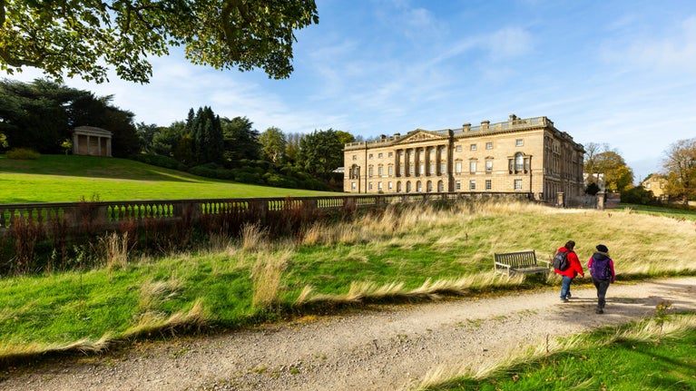 Visitors walking near the 18th century palladian mansion at Wentworth Castle, South Yorkshire